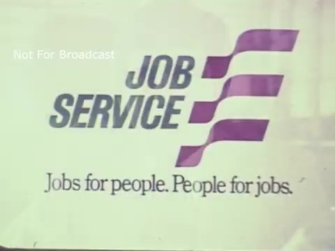 The still features a promotional graphic for 'Job Service Ohio,' emphasizing the slogan 'Jobs for people. People for jobs.' It showcases a clean, professional design typical of public service announcements from the 1970s. The color scheme includes purple and white, with bold text making the message clearly visible. The overall aesthetic reflects the era's approach to employment services and community support.