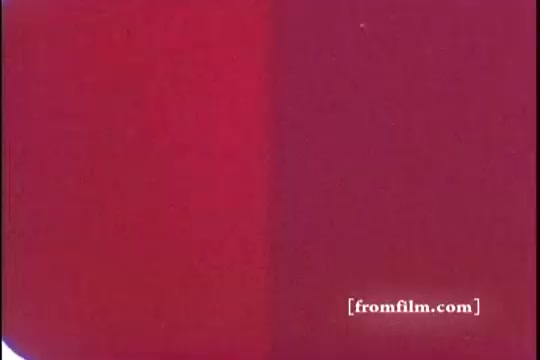 The 16mm still from the 1970s Kellogg's Corn Flakes advertisement features a vibrant red background, likely symbolic of excitement and energy. The context of Babe Ruth suggests a focus on nostalgia and sports heritage, connecting the product to themes of American culture and childhood memories. The visual appeal is simple yet striking, promoting a connection to the brand through evocative imagery.