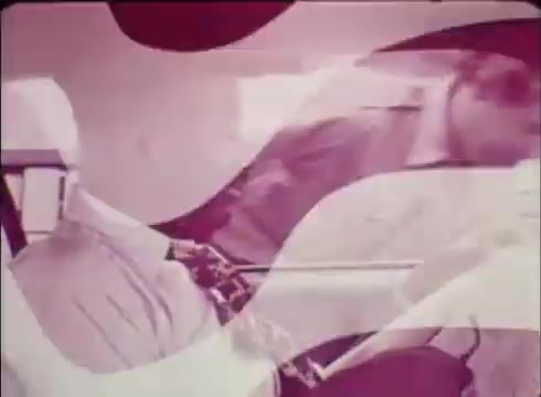 The still features a dynamic image that is typical of vintage public service commercials. It likely showcases individuals engaged in conversation, emphasizing the personal connection of Job Services. The use of soft pink hues and abstract shapes hints at a focus on accessibility and encouragement in the hiring process. Overall, the visual elements suggest a supportive environment aimed at helping employers fill job openings.