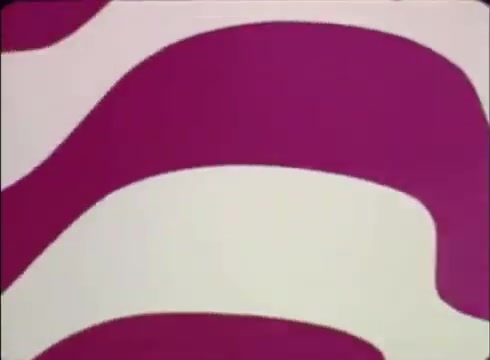 The still features a vibrant, abstract design with flowing curves and waves in shades of pink and white. This graphic background sets a lively tone, likely intended to capture viewers' attention for the public service announcement promoting Job Service. The emphasis is on the importance of using Job Service to assist businesses in filling job openings. The style reflects the era, typical of 16mm prints used in promotional materials during that time.