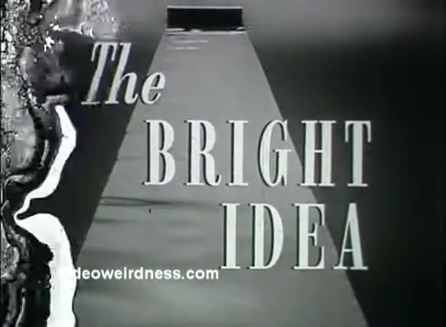 The still from 'Kaiser Aluminum - The Bright Idea' features bold, stylized text reading 'The BRIGHT IDEA,' accompanied by a light beam or gradient effect that creates a sense of illumination and focus. The imagery suggests innovation and modernity, aligning with the theme of enhancing quality of life through the use of aluminum. The overall aesthetic reflects a mid-century design, emphasizing efficiency and cost-effectiveness.
