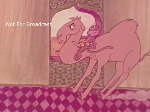 The still features a whimsical animated scene from the 1970s PSA 'You are what you eat,' showcasing a monkey riding a camel. The background is decorated with vibrant colors and patterns, typical of the era's animation style. The characters appear playful and exaggerated, conveying a lighthearted message about nutrition.
