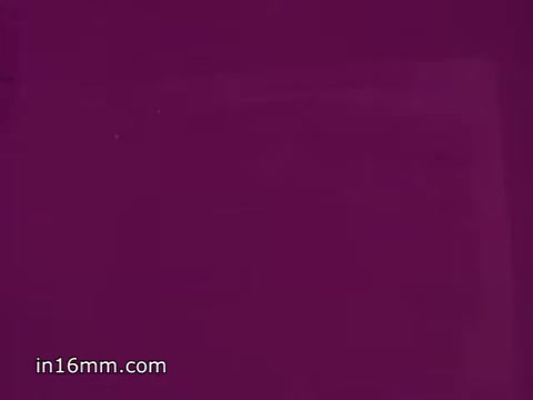 The still from 'Flu Shot PSA - 1968' features a predominantly purple background. The visual likely serves as a simple, stark setting for the accompanying voice-over message about the importance of flu vaccination during the forecasted rise of the Asian flu. The PSA emphasizes protecting oneself and following public health advice regarding flu prevention and treatment.