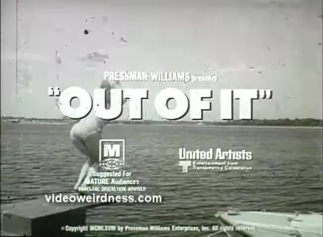 The still from the trailer of 'Out of It' (1969) features a caption with the film's title prominently displayed with a rating of 'M' for mature audiences. It shows a figure mid-air, diving into a body of water, suggesting a playful or dynamic scene. The production credits indicate that it was produced by Pressman-Williams and distributed by United Artists. The aesthetic of the frame reflects a vintage style typical of the late 1960s.