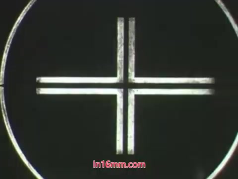 The still features a simple crosshair graphic, reminiscent of a target or focus point, likely used in the context of a public service announcement. In the dialogue, Ollie expresses distress over his plant's death after using a 'bug bomb,' while Kukla responds with concern. This PSA highlights the potential dangers of using pesticides improperly, emphasizing the importance of being cautious when dealing with chemicals in gardening. The puppetry adds a playful element to the serious message.