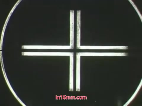 The still from the 16mm PSA features a simple graphic, likely representing a target or crosshair, which might indicate focus or emphasis on an important message. This relates to the context of the conversation between the puppets Ollie and Kukla about the dangers of using pesticides and their impact on plants. Ollie's mistake in trying to protect his plant results in its death, underscoring the dangers of improper pesticide use. The humorous dialogue highlights the educational intent of the PSA from the USDA in the 1960s.