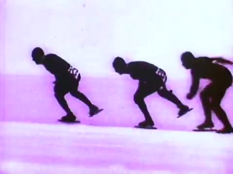 The still from the Mobil I oil commercial features a sequence of three skaters in motion, gliding smoothly across an ice surface. The skaters are silhouetted against a vibrant pink background, emphasizing their dynamic postures. This stylized imagery highlights speed and fluidity, conveying the performance benefits of Mobil I oil.