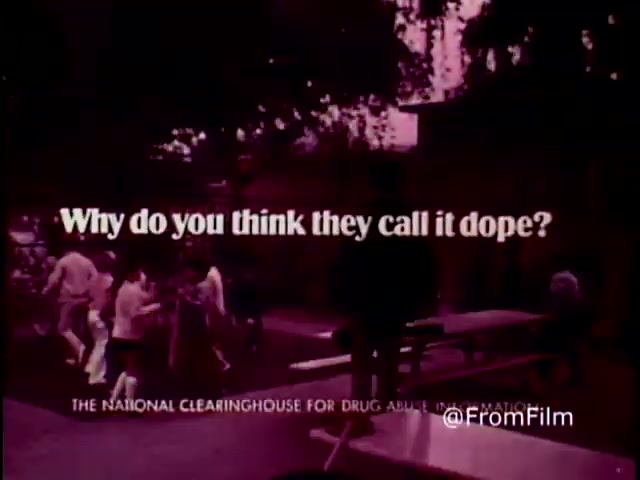 The still features a stark, provocative message: 'Why do you think they call it dope?' set against a faded, nostalgic background, indicative of the 1970s. The use of bold typography contrasts with a scene depicting social interactions, likely in a park or similar outdoor setting. The film aims to challenge perceptions of drug use through its engaging yet cautionary statement, part of an anti-drug public service announcement by the National Clearinghouse for Drug Abuse Information. The overall tone captures a moment in time, reflecting the era's cultural attitudes towards drugs.   .
