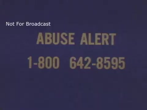 The still features a simple blue background with the text 'ABUSE ALERT' prominently displayed in yellow. Below it, a phone number '1-800 642-8595' is provided for reporting child abuse. A note at the top indicates that the content is 'Not For Broadcast.' The design is straightforward and aimed at raising awareness about child abuse.