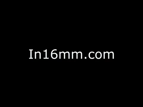 The still features a simple black background with white text that reads 'In16mm.com.' This format suggests a focus on vintage film, possibly related to the preservation or showcasing of 16mm film content, including public service announcements from the 1970s, specifically addressing child abuse in Wheeling, WV. The overall aesthetic is minimalist and suggests a transitional medium, highlighting the era of the film.
