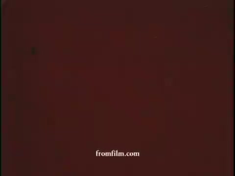 The still from the 1965 Smokey Bear PSA features a faded brown background, likely indicating the age of the film. Smokey Bear, the iconic mascot, is central to the message promoting forest fire prevention, emphasizing personal responsibility. The overall tone is nostalgic, reflecting the visual style of mid-20th century public service announcements.