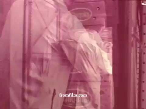 The still from 'Chatham Supermarket Commercials' portrays a scene likely set within a supermarket environment. It features elements such as produce (apples and bananas), shopping carts, and various promotional themes like comparison and coupons. The imagery is tinted with a reddish hue, which may suggest a focus on freshness and appeal. Key items highlighted include meats, potatoes, and steak, emphasizing the supermarket's variety and quality offerings. The overall context suggests a vibrant and dynamic shopping experience aimed at attracting customers.