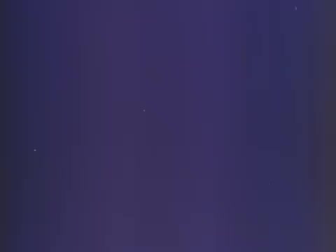 The still from the 1970s Gaines Burgers dog food commercial likely features a simple and engaging visual, typical for advertisements of that era. It may emphasize the product's appeal to both dogs and their owners, showcasing the individually wrapped patties that resemble hamburgers. The blue background could highlight the brand's logo or the product itself, creating a nostalgic feel that resonates with pet owners. The overall aesthetic would be designed to grab attention and communicate the unique qualities of Gaines Burgers.