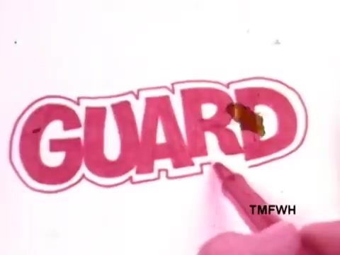 The still features a close-up of a vibrant, hand-drawn word 'GUARD' in bold lettering, created with a Flair pen. A person's hand, holding the pen, is poised as if in the midst of writing or emphasizing the word. The overall aesthetic suggests a playful and creative vibe, representative of the pen's versatility. The image has a warm, slightly faded quality typical of 16mm film.