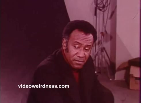 The 16mm still from 'Come Back, Charleston Blue' features a contemplative moment, likely highlighting themes of introspection and struggle common in blaxploitation films. It showcases a character who is presumably one of the leads, reflecting the film's concentration on the African-American experience during the era. The film continues the story from 'Cotton Comes to Harlem,' deepening the narrative around Coffin Ed Johnson and Gr. The promotional aspect likely aims to emphasize the social commentary and cultural significance embedded within the movie.