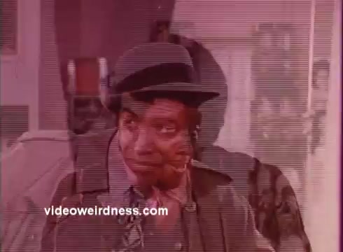 The still from 'Come Back, Charleston Blue' features a character likely associated with the themes of crime and social commentary prevalent in blaxploitation films. The character displays a mixture of determination and weariness, reflecting the struggles faced in a crime-ridden urban environment. The film, serving as a sequel to 'Cotton Comes to Harlem,' continues the narrative of Coffin Ed Johnson and Gr. as they navigate their roles within the community, marking a significant contribution to the blaxploitation genre inspired by Chester Himes' work.