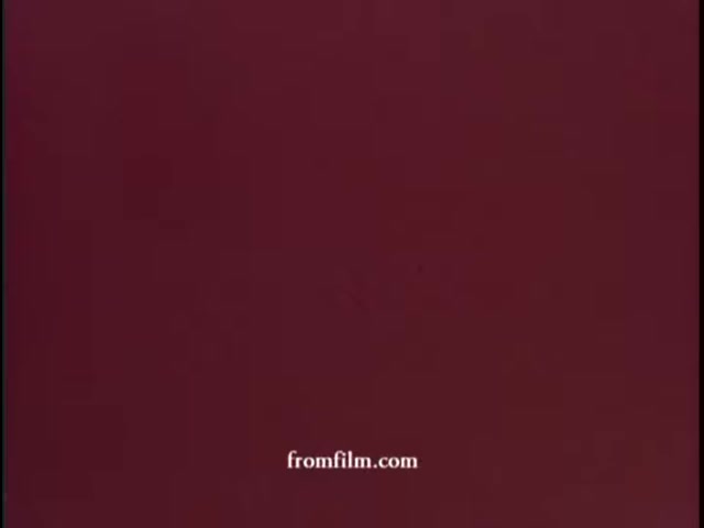 The still features a plain maroon background, possibly used as a title card or backdrop for the WCBS promotional content. The contextual focus on Lucille Rich discussing restaurants indicates that this might be an introductory frame for a segment highlighting her insights or reviews related to dining establishments in the early 1970s. The simplicity of the image likely serves to draw attention to the upcoming narrative rather than distract with visuals.