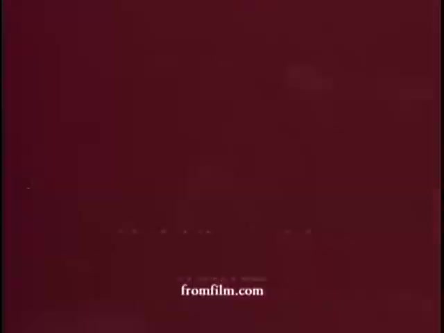 The 16mm still from 'WCBS Promo - Lucille Rich on Restaurants' features a simple, solid maroon background. There is no visible content or imagery related to the promo itself, indicating the visual may be either a blank frame or a placeholder. The text 'fromfilm.com' is subtly displayed at the bottom.