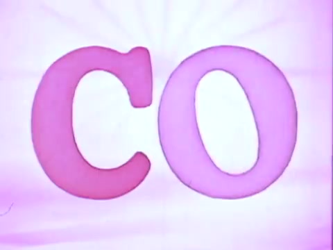 The still features the letters 'C' and 'O' prominently displayed, with 'C' in a pink hue and 'O' in a slightly lighter pink. The background is a soft gradient, enhancing the vibrant colors of the letters. The overall aesthetic reflects a playful and energetic vibe typical of a commercial, likely aimed at highlighting the brand's fun and stylish appeal in hair care.