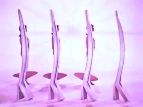 The still features four stylized figures, positioned in a row, each appearing slender and elongated against a vibrant, pink backdrop. They are posed in a manner that suggests elegance and fashion, possibly showcasing the effects of Adorn Hairspray. The overall composition conveys a playful yet sophisticated aesthetic, highlighting the product's appeal in a visually striking way.