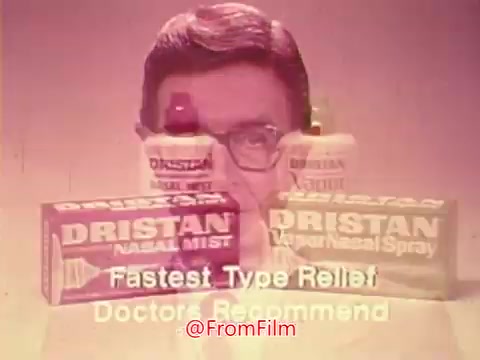 The still features a classic 1970s commercial for Dristan, showcasing two products: Dristan Nasal Mist and Dristan Nasal Spray. The packaging is brightly colored with bold lettering. A spokesperson, likely a doctor or expert, is present in the background, promoting the products with phrases like 'Fastest Type Relief' and 'Doctors Recommend.' The overall presentation exudes a retro style characteristic of advertisements from that era.