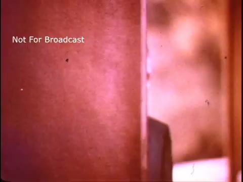 The still features a close-up of a doorway, with a partially obscured view of a person on the other side. The colors appear warm and slightly faded, typical of 1970s film. The text 'Not For Broadcast' is clearly visible, indicating a non-public nature for this footage, likely used for educational or promotional purposes related to the Job Corps program.