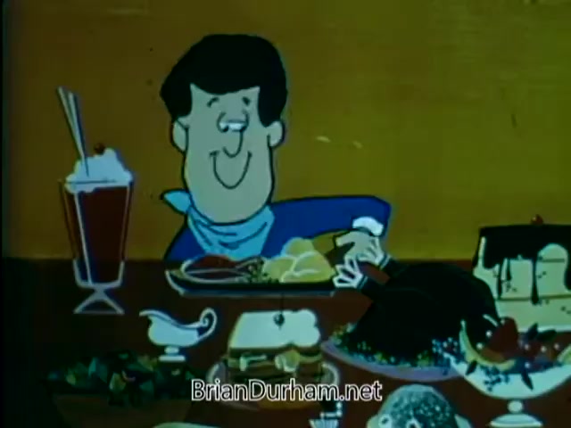 The still from the 1967 American Chiropractic Association PSA features an animated character sitting at a table filled with a variety of food items. The character has a cheerful expression, indicating enjoyment of the meal. The table is laden with dishes like meats, desserts, and a drink, highlighting a feast-like scene. This imagery likely serves to reflect themes of health and wellness, encouraging viewers to consider the importance of nutrition and lifestyle choices in relation to chiropractic care.