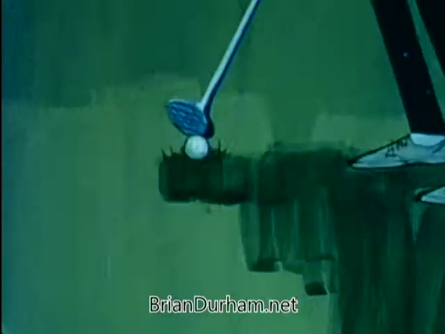 The still from the 'American Chiropractic Association PSA - 1967' features an animated scene with a golfer preparing to swing a golf club at a ball. The golf ball is precariously positioned near the edge of a cliff, suggesting a moment of tension or impending action. The use of animation adds a playful tone, likely aimed at conveying a message about chiropractic health in an engaging manner.