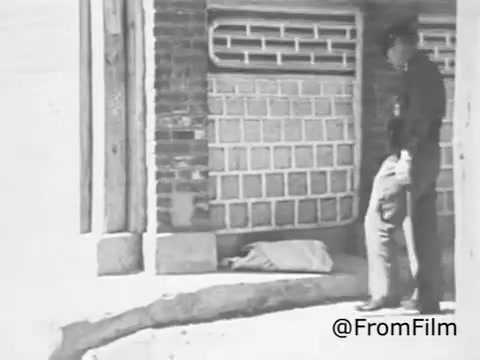 The 16mm still from the 1969 Christian Children's Fund Public Service Announcement likely depicts a scene intended to highlight social issues related to poverty and the need for child welfare. The presence of a police officer suggests a focus on the challenges faced by vulnerable children in difficult environments. The imagery likely aims to evoke empathy and encourage support for the organization’s mission of child sponsorship and development programs.
