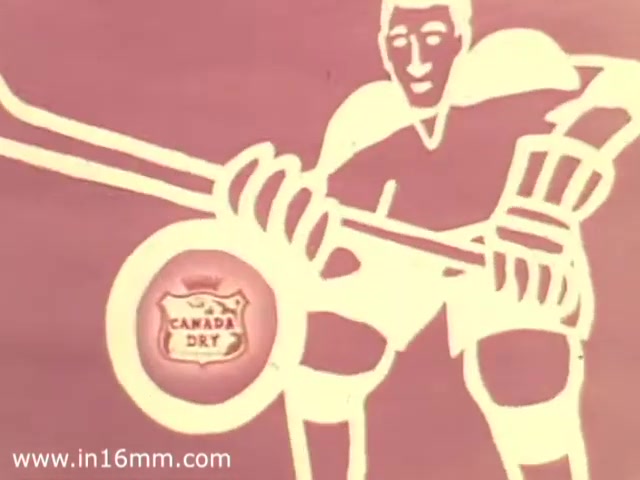 The still from the 'Canada Dry Buffalo Sabres Commercial' features a stylized, simplified illustration of a hockey player in action, holding a hockey stick. The background is a muted pink, and the player's attire is minimalistic, emphasizing bold outlines. At the center, there is a prominent logo for Canada Dry, framed in an oval design. The overall aesthetic reflects a classic 1970s advertising style, combining sports and product branding in a visually engaging way.