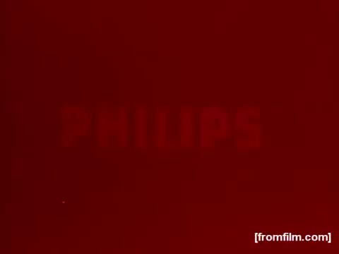 The still features the word 'PHILIPS' prominently displayed against a rich red background. The image likely captures the bold, attention-grabbing style typical of 1970s advertisements. This aesthetic aligns with the era's marketing trends, appealing to a vibrant and dynamic audience.  For more vintage content like and subscribe on YouTube.