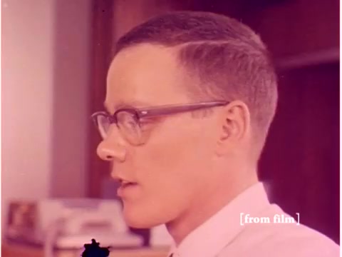 The still from the 1967 Bell System film features a profile shot of a man wearing glasses and a white shirt, possibly an engineer or technician. The background shows what appears to be office equipment. The image exhibits a muted color palette typical of the time, and there's a noticeable lab defect at the bottom. The film likely explores the role of technology in preventing data transmission errors, showcasing tools like computers and oscilloscopes.