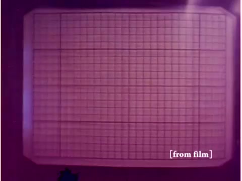 The still shows a grid display, likely from an oscilloscope or similar electronic device, with a pinkish hue. This fits well within the context of the Bell System film, which features technology from the 1960s, including computers and oscilloscopes. The visible grid suggests a focus on data transmission or error analysis, typical of engineering demonstrations from that era. The lab defect noted indicates that the image quality may be compromised.
