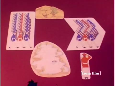 The still from 'Bell System - Preventing Data Transmission Errors' features a colorful arrangement of graphics, likely representing data or concepts related to data transmission. It includes various shapes and figures laid out on a background, which suggests a playful or illustrative approach to communicating technical information. Given the context of the film, these visuals might serve to explain concepts such as signal patterns or error correction methodologies, even though the specific details and clarity are compromised due to film defects.