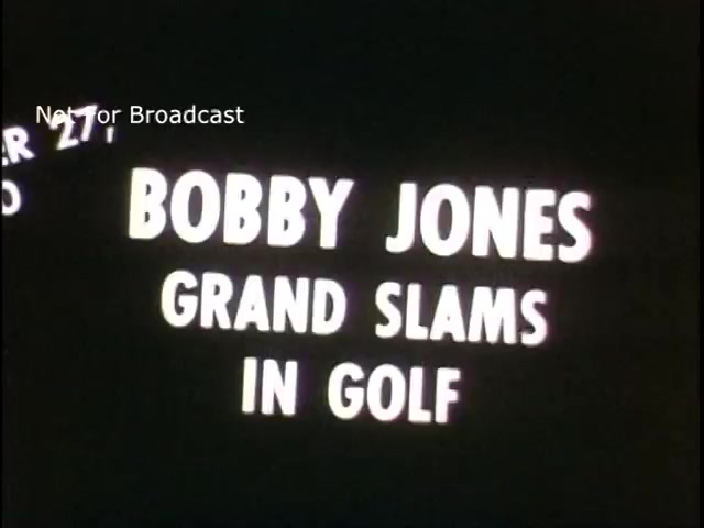 The still features bold white text on a black background, reading 'BOBBY JONES GRAND SLAMS IN GOLF.' It suggests a focus on famous golfer Bobby Jones, highlighting his achievements in the sport. The phrase indicates a historical context related to his grand slam victories, which are significant milestones in golf. The label 'Not for Broadcast' implies it may have been intended for internal or archival use rather than public airing.