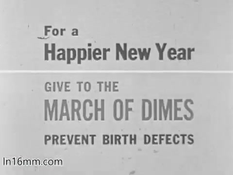 The still features text promoting a message for a 'Happier New Year,' encouraging donations to the March of Dimes to help prevent birth defects. The design is straightforward, emphasizing the importance of support for the organization.