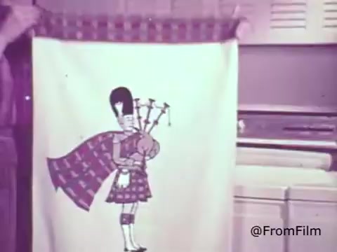 The still features a vintage design showcasing a playful illustration of a bagpiper on a fabric, likely a towel or curtain. The bagpiper wears traditional Scottish attire and prominently displays a set of bagpipes. The setting suggests a domestic scene, possibly in a laundry or kitchen area, highlighting Rinso Detergent's marketing focus on cleanliness and vibrancy. The nostalgic color palette and whimsical character reflect the advertising style of the 1960s.    for more insights!