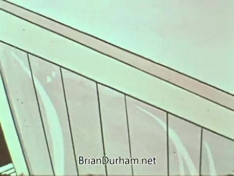 The still from the 'American Hospital Association PSA' features an animated depiction focusing on architectural elements, likely from a hospital setting. The image exhibits a modern and simplified design, with lines and colors suggesting a clean and organized environment. The visual emphasizes a positive and welcoming atmosphere, aligning with the message of health and care.