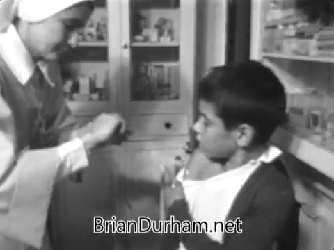 The still from the 'Catholic Bishops' Overseas Aid Fund PSA' shows a nurse assisting a young boy, highlighting a moment of care and support. This imagery underscores the themes of health and compassion, contrasting with the stark realities faced by communities in need. It reinforces the message about the growing disparity in access to resources and the importance of support from organizations like Catholic relief services to bridge this gap.