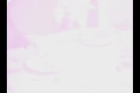 The still from the highly faded Ayds Diet Plan commercial features blurred images with a washed-out color palette, primarily light pinks and whites. There are indistinct shapes and outlines, possibly hinting at people or objects, but the details are hard to decipher due to the fading and low contrast typical of aged film stock. The overall mood suggests an old, nostalgic advertisement focused on dieting.