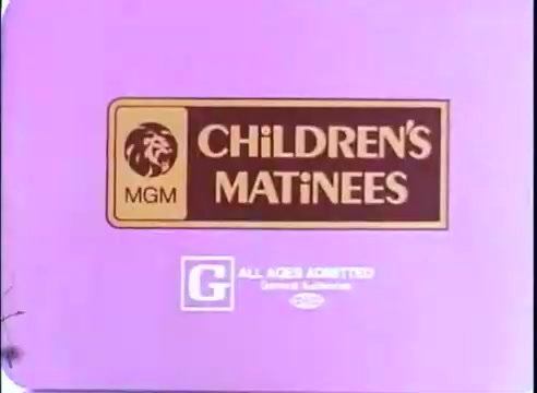 The still features a promotional logo for 'Children's Matinees' from MGM, set against a vibrant purple background. The logo includes the MGM lion symbol and the text 'CHILDREN'S MATINEES,' emphasizing family-friendly content with a 'G' rating, indicating that it is suitable for all ages. The design reflects a playful and inviting theme typical for children’s film promotions.