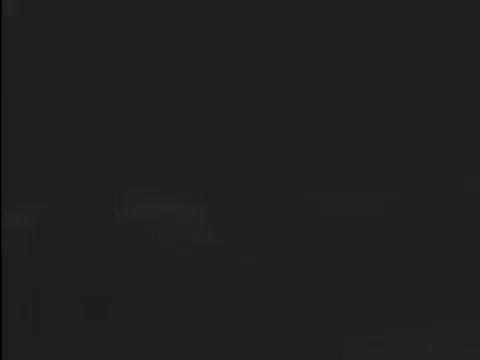 The still from the PSA 'New Guardrails' depicts a crash scenario highlighting the effectiveness of guardrails designed to slow down vehicles rather than completely stop them. This design aims to prevent cars from crossing into oncoming traffic, thereby reducing the risk of head-on collisions and potentially saving lives. The PSA was produced in 1968 by the Sheet Committees of the American Iron and Steel Institute to raise awareness about road safety and the importance of effective guardrail systems.