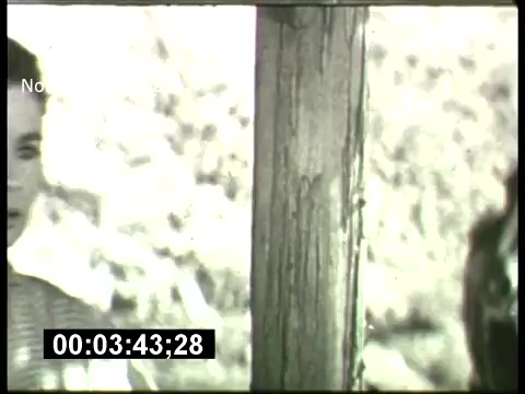 The still from the 'ABC Sunday Night Movie' promos in the 1960s features a black-and-white scene with a focus on a character, possibly in a dramatic moment. The image shows part of a wooden structure, suggesting an outdoor or rustic setting. The time code indicates it's part of a sequence, adding a sense of nostalgia associated with classic TV movie promotions.