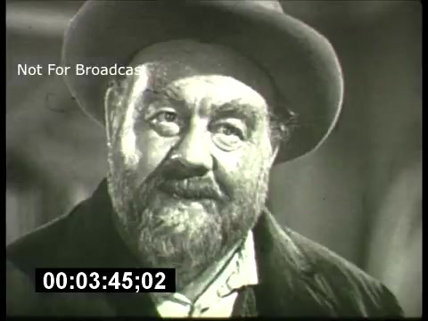 The still from the 'ABC Sunday Night Movie' promos in the 1960s depicts a bearded man wearing a hat, characterized by a warm expression. The image is in black and white, typical of the era, capturing a moment likely meant to evoke a sense of nostalgia or drama. The timestamp suggests a specific moment within the promo, providing a snapshot of the cinematic style and content viewers could expect during these broadcasts.