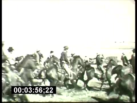 The still features a scene from the ABC Sunday Night Movie promos of the 1960s, depicting a dynamic moment with a large group of people on horseback. The image captures action, likely portraying a western or historical scene, indicated by the attire of the riders and the open landscape. The overall tone of the still suggests a classic cinematic style, characteristic of the era's film promotions. The timestamp indicates this moment occurs at 3 minutes and 56 seconds into the segment.