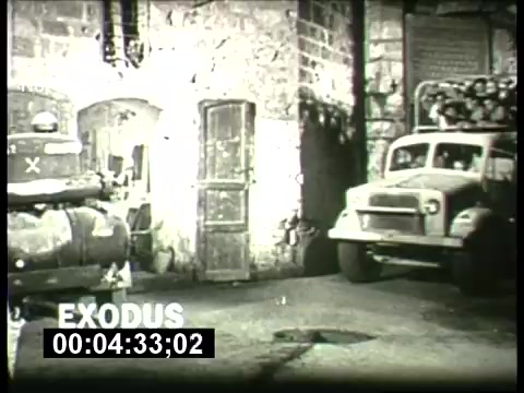 The still features a scene from 'Exodus,' highlighted as part of the ABC Sunday Night Movie promos from the 1960s. It showcases a black-and-white street setting with vintage vehicles and a backdrop of stone buildings, capturing a historical atmosphere. The film title 'EXODUS' is prominently displayed, emphasizing its focus on immigration and historical themes.