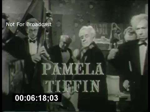 The still from the 'ABC Sunday Night Movie' promos from the 1960s features a classic black-and-white aesthetic. It prominently displays the name 'Pamela Tiffin' in a bold, elegant font. In the background, several men are seen in tuxedos, likely part of an ensemble in a setting that suggests a theatrical or cinematic atmosphere. The overall vibe is reminiscent of vintage television promotion, capturing the charm of 1960s entertainment. The time stamp indicates a specific moment within the promo.