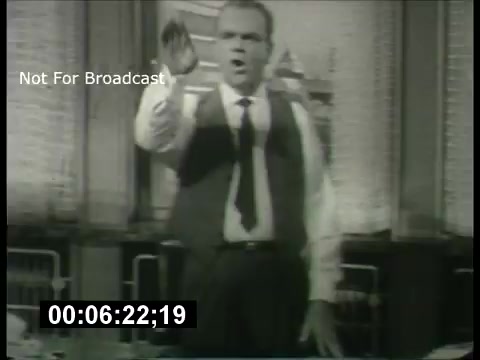 The image shows a still from a 1960s promo for the ABC Sunday Night Movie. It features a man passionately delivering a speech, dressed in a vest and tie, possibly in a dramatic or comedic context. The background suggests an indoor setting, possibly a stage or studio, and includes a timestamp indicating it's taken from a film reel. The caption 'Not For Broadcast' indicates it's likely a behind-the-scenes or archival shot, not intended for public airing.