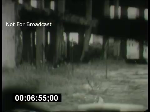 The still appears to be a black-and-white shot from the 1960s promotional material for the ABC Sunday Night Movie. It features a dimly lit urban environment, possibly highlighting abandoned buildings or a desolate street. The scene conveys a sense of mystery or suspense, typical of movie promotions of that era. The timestamp indicates a specific frame in the sequence, and the 'Not For Broadcast' label suggests it's intended for internal use or preview only.