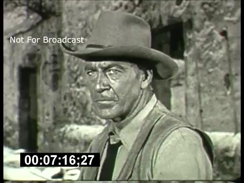 The still shows a rugged man wearing a cowboy hat and a vest, looking intensely at the camera. The background appears to be a dusty, desolate landscape, consistent with classic Western themes. The notation 'Not For Broadcast' indicates that this image is part of archival footage, likely related to ABC's promotional materials for their Sunday night movies during the 1960s. The aesthetic and production quality reflect the era's television style.